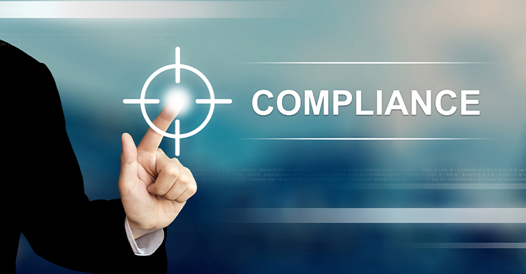 Pharmaceutical Trade Show Hospitality: The Complete Guide 7 A hand in a dark business suit presses a glowing target icon on a blue digital background beside the word "COMPLIANCE." This conceptual graphic represents pharmaceutical trade show hospitality compliance by emphasizing rules, oversight, and operational accountability.